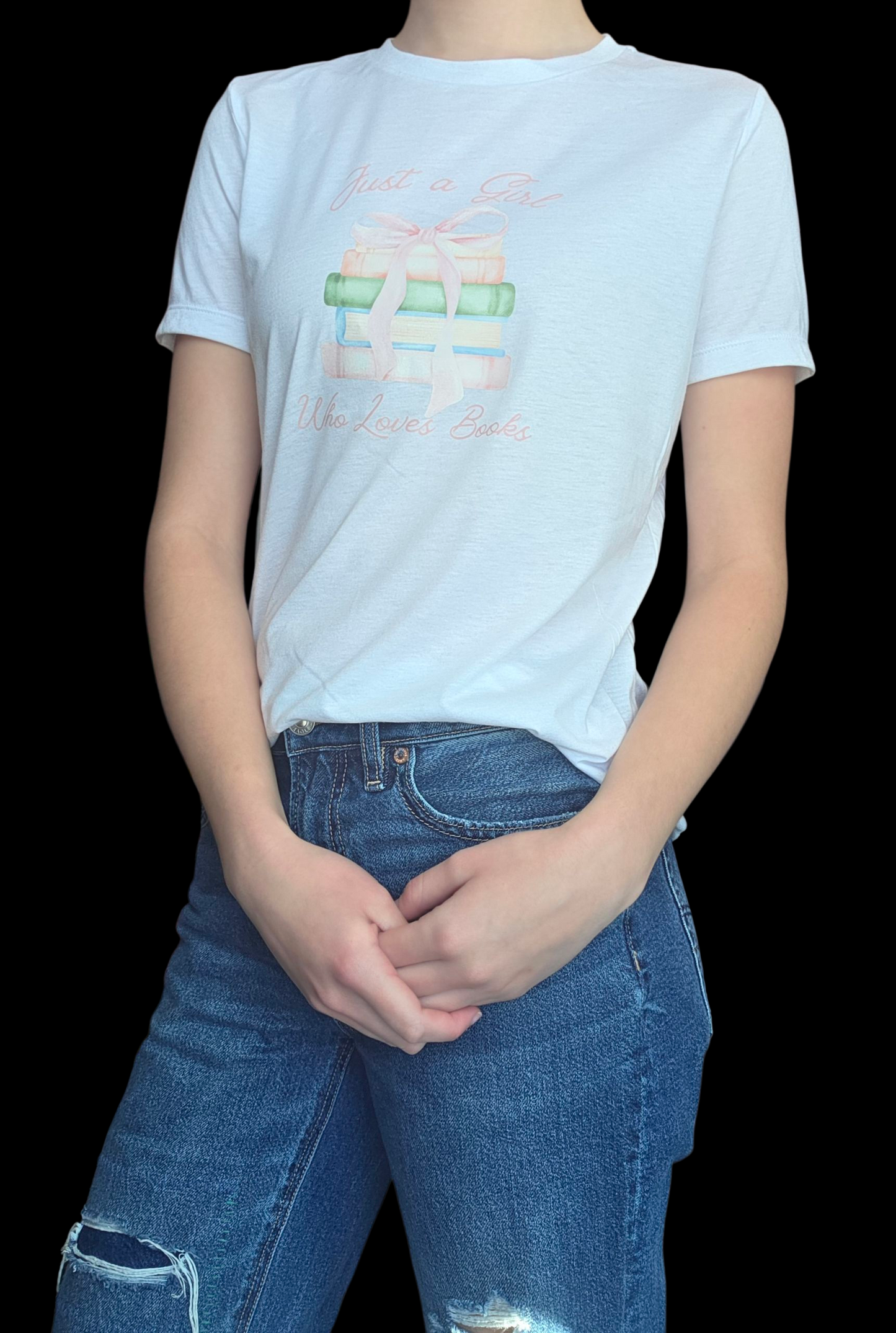 Person wearing a white t-shirt with a graphic design and blue jeans on a black background