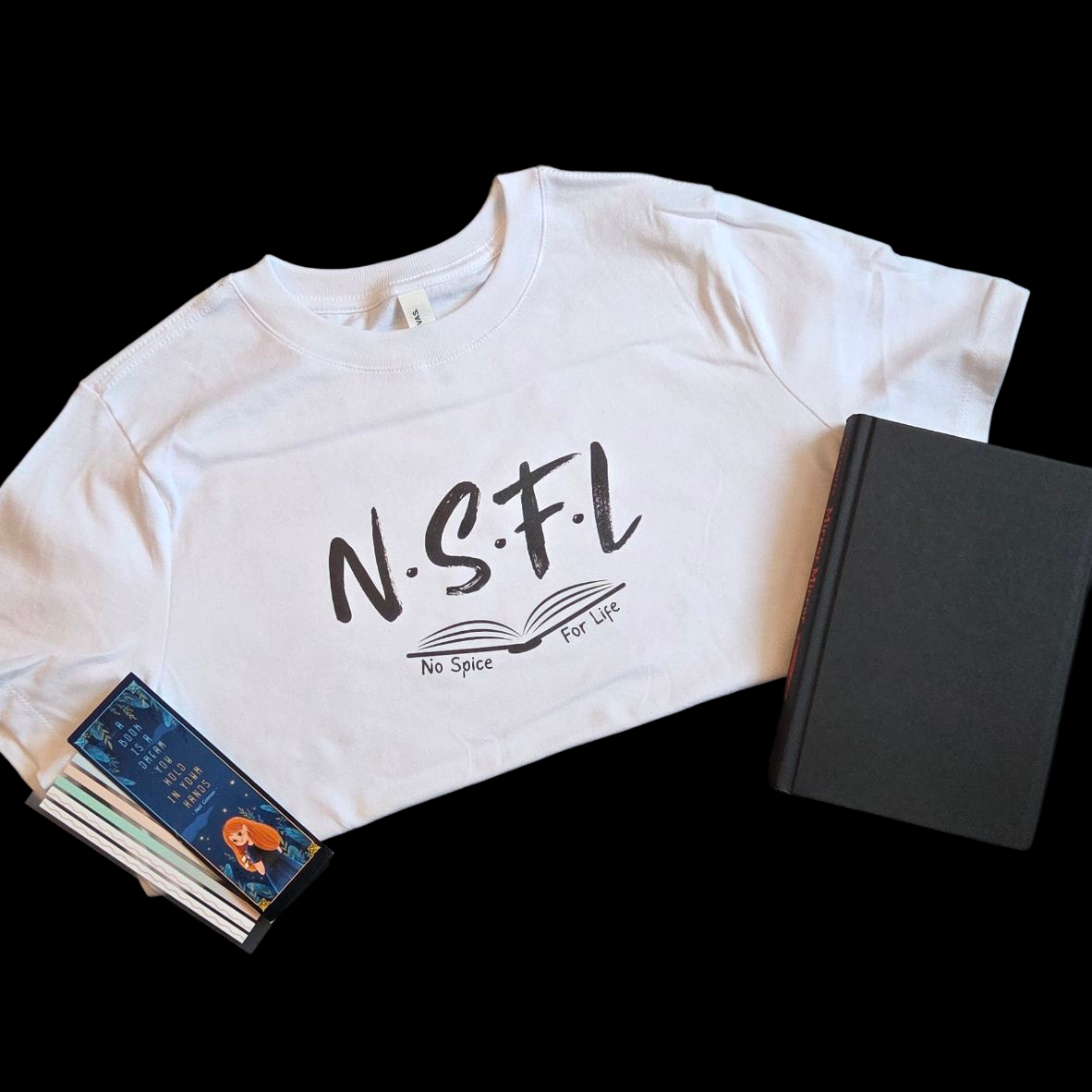 White t-shirt with 'NSFL' text and an open  book.