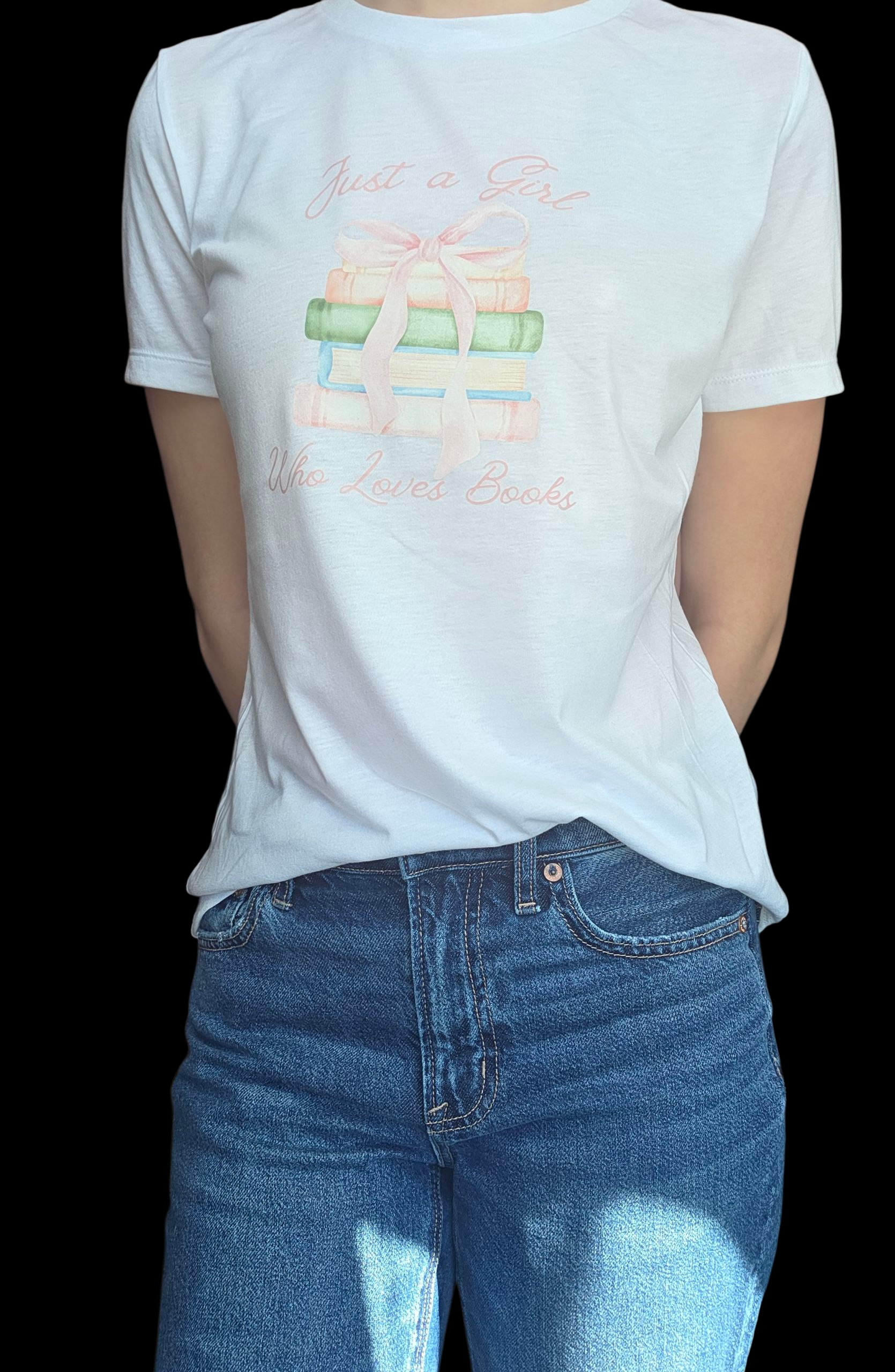 Person wearing a white t-shirt with a graphic design and blue jeans on a black background