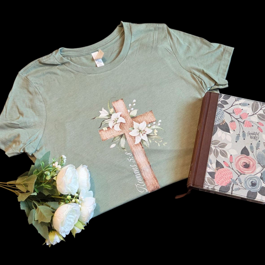 Green t-shirt with floral design on a black background