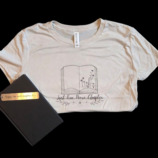 Beige crop top with graphic design on a black background