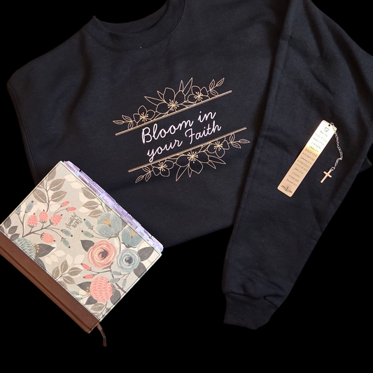 Black sweatshirt with floral design and text on a black background