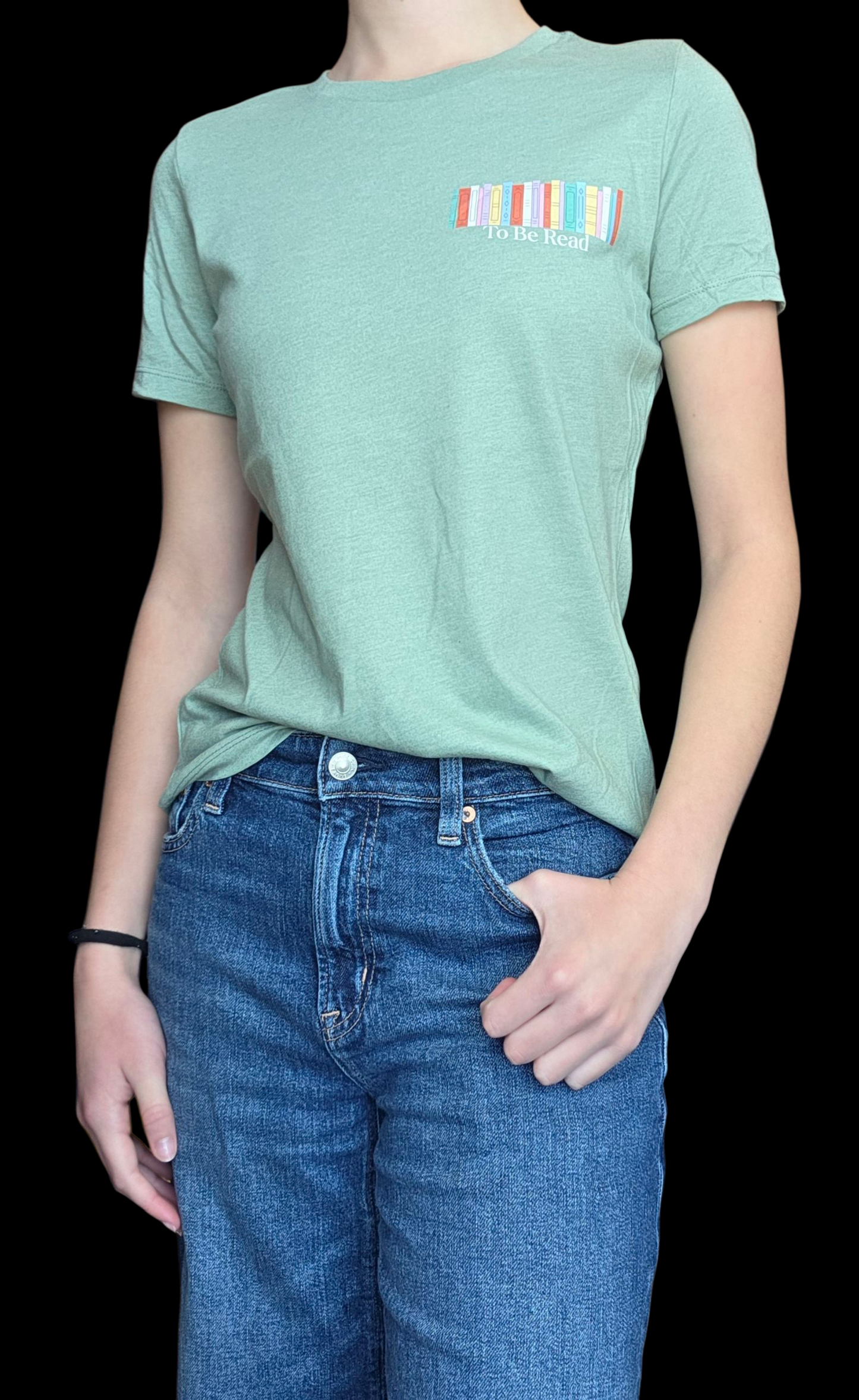 Person wearing a green t-shirt with a colorful logo and blue jeans on a black background